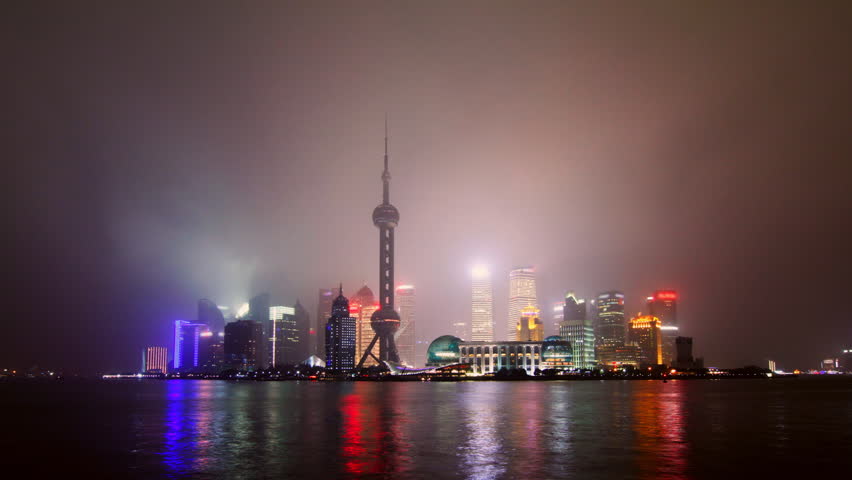 Time lapse of Shanghai skyline in drizzle night - Shanghai, China.