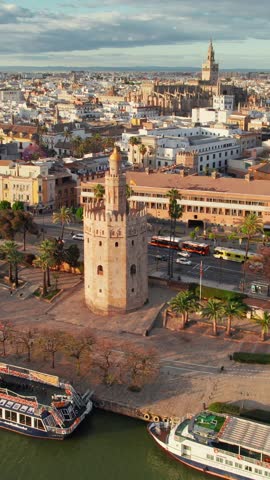 Flighting over the Seville city center at sunset, Spain. Aerial view of the Seville cityscape with corrida arena, Cathedral and Guadalquivir riverfront. Andalusia capital in summer