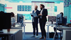 Team of investors analyzing profit amount and making decisions to fund another business project, examine big data on a huge display. Associates verifying efficiency and budget. Camera B. - Powered by Shutterstock - Get 15% off with code: PIKWIZARD15