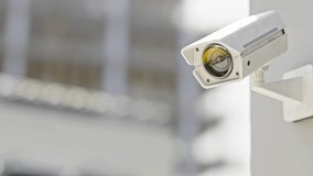 CCTV camera installed on wall of the building. Scan the area for surveillance purposes. Can be used background in security work. Animation, 3D Render. - Powered by Shutterstock - Get 15% off with code: PIKWIZARD15