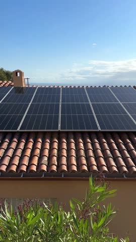 Solar electric batteries, cell panels or PV modules is installed on roof. Photovoltaic Solar array system for producing clean ecological electricity. Renewable energy concept, energy saving in Europe