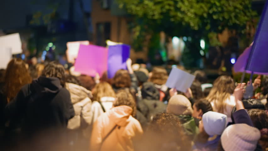 Feminist protester walk night wave flag. 8 march feminism protest symbol. Many demonstration banners. Woman riot anti violence. Female rights picket. Girl power fight. People rebels hold strike sign.