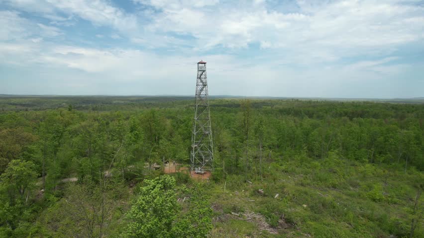 The Mountain Fire Lookout Tower, located in Mountain, Wisconsin was erected by the Mountain CCC and completed in 1935. This tower stood guard over the Nicolet National Forest.