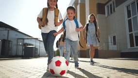 Happy children walking down street. Kids playing with ball road. Group of children enjoying sunny day. children street near school. Excited kids with backpacks walking. Children playing on road school - Powered by Shutterstock - Get 15% off with code: PIKWIZARD15