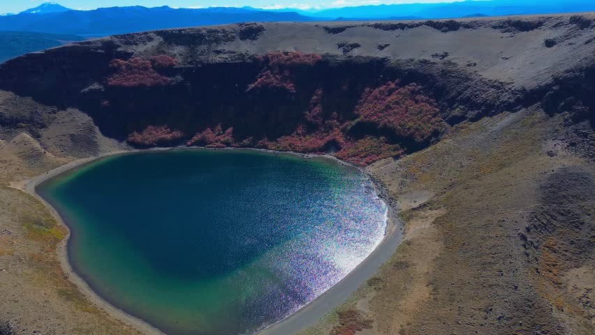 Aerial view of the Batea Mahuida Volcano with a lagoon in its crater located in Villa Pehuenia