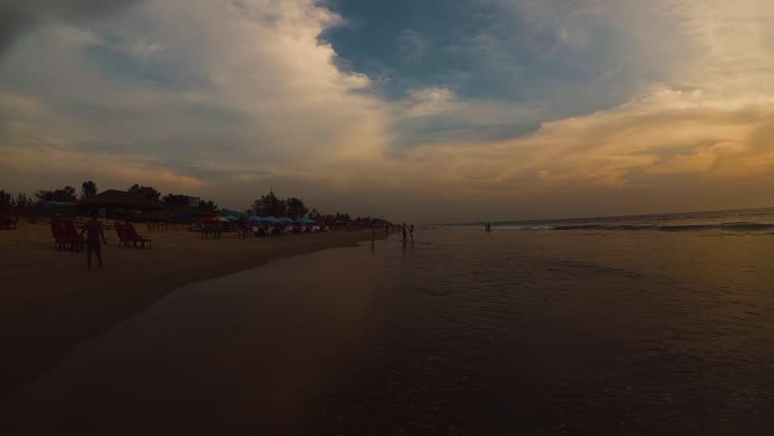 Slow Motion Shot of People at the Beach Enjoying During The Sunset 1080