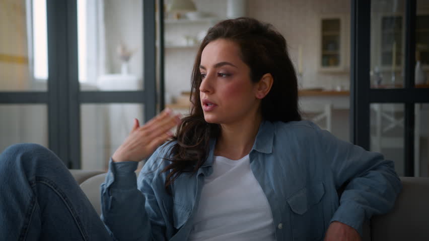 Caucasian suffer woman on sofa couch home girl female waving hands refresh cooling hot high air temperature broken conditioner summer reduce heat climate control system discomfort hormonal imbalance