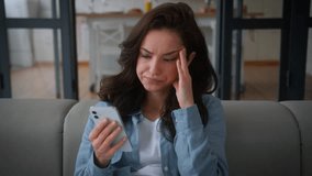 Caucasian confused girl female buyer client customer influencer woman on sofa home couch online shopping failure bad news social media mobile phone error lost upset sad problem trouble internet fail - Powered by Shutterstock - Get 15% off with code: PIKWIZARD15