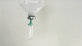 Slow-motion HD drops inside selective focus IV drip Drop of Close-up of the Infusion Process Intravenous drip chamber Closeup of recovery treatment - Powered by Shutterstock - Get 15% off with code: PIKWIZARD15