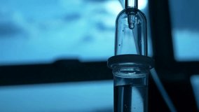 copy space iv drip the medicine from the bag fills the iv drip transfusion system recovery fluid loading specialist does his job using modern methods - Powered by Shutterstock - Get 15% off with code: PIKWIZARD15