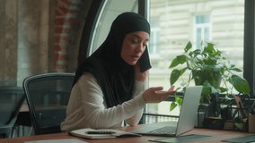 Angry businesswoman talking mobile phone quarrel conflict argue Arabian muslim islamic woman hijab displeased female girl business employer call smartphone in office problem laptop talk shout stress - Powered by Shutterstock - Get 15% off with code: PIKWIZARD15