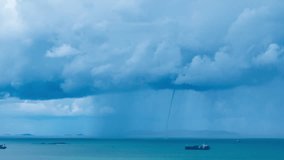 Time lapse Tornado and thunderstorm funnel cloud in an open sea near Cargo Container Ship. Container Ship running through the Tornado concept Marine cargo insurance service. - Powered by Shutterstock - Get 15% off with code: PIKWIZARD15