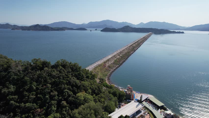 Aerial journey over Hong Kong Tai Po Tai Mei Tuk, Pat Sin Leng Country Park,Plover Cove Reservoir Dam, and Long Mei Beach, a natural playground for hiking, fishing, cycling,water sports