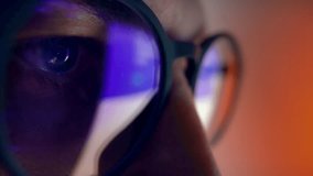 Eyes of Man in Glasses Looking at Computer Screen with Glow Code of Web Development. Concentrated Sight of Programmer Person Working Online on Internet Site. Macro Shot View of Moving Image and Text - Powered by Shutterstock - Get 15% off with code: PIKWIZARD15