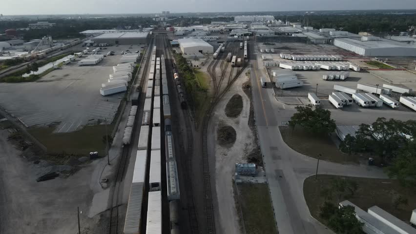 Aerial view of rail road tracks and trailers in abandoned yard in florida