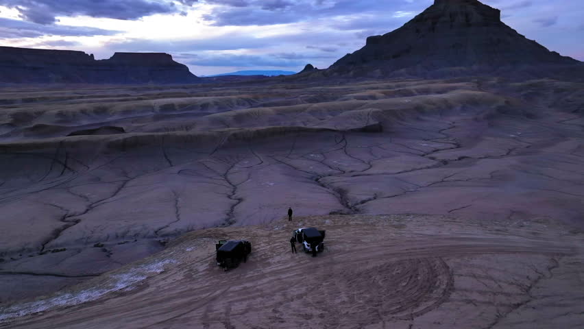 Aerial Panning Shot Of Tourists With Off-Road Vehicles Near Factory Butte At Sand Hallow State Park - Moab, Utah