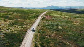 Inspiring aerial footage of adventure vehicle travel on mountain plateau in faraway destination. Overlanding travel trend in tourism, camping with 4x4 van - Powered by Shutterstock - Get 15% off with code: PIKWIZARD15