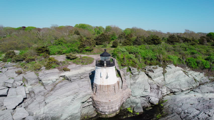 Backward flight away from Castle Hill Lighthouse over Narragansett Bay, Newport, RI.