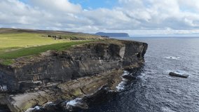 Aerial View of Picturesque Shoreline of Scotland UK, Cliffs, Caves and Green Pastures Above Sea Waves - Powered by Shutterstock - Get 15% off with code: PIKWIZARD15