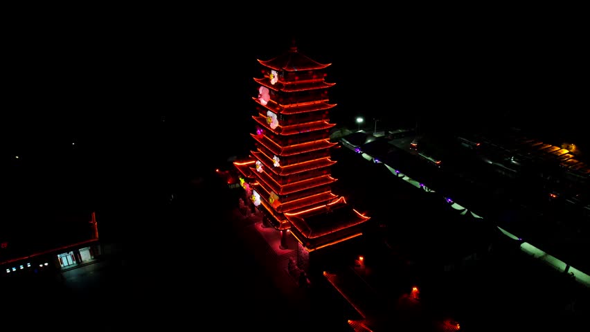 Chinese pagoda illuminated at night in Zhangjiajie Park. Aerial
