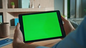 Closeup hands holding mockup tablet in agency office close up. Unknown businessman browsing online application on green screen computer at work desk. Freelancer looking video on chroma key device. - Powered by Shutterstock - Get 15% off with code: PIKWIZARD15