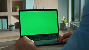 Entrepreneur browsing mockup laptop at modern workplace close up. Unrecognizable businessman looking on green screen computer at office desk. Manager watching educational webinar at chroma key device. - Powered by Shutterstock - Get 15% off with code: PIKWIZARD15