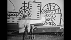 Retro animated child figure talk, walk. Funny black white animation. Stop-motion puppet miniature. Handmade homemade plasticine cartoon with transport, comedy characters. Vintage film. 1980s archive - Powered by Shutterstock - Get 15% off with code: PIKWIZARD15