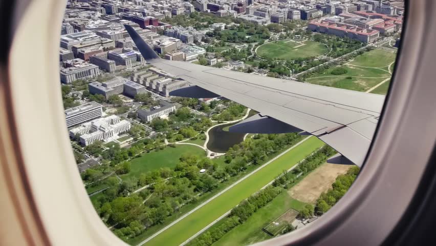 
Aerial view of the city of Washington D.C., the capital of the United States, Aerial view from the airplane window flying over the Potomac River, monuments and neoclassical buildings, the Capitol, th