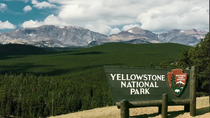 lookout with panoramic view of the entrance and sign of Yellowstone National Park located largely in Wyoming and extending into parts of Idaho and Montana, USA
