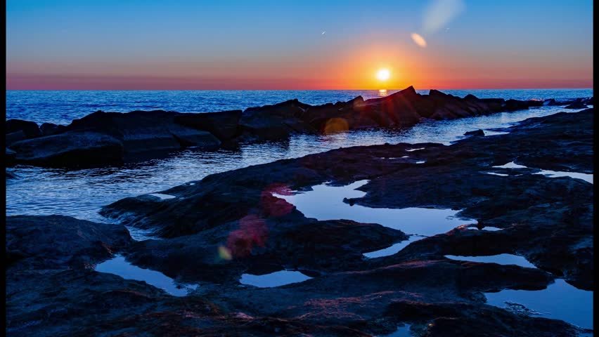 Time lapse of the sun rising by Lake Michigan in Chicago, Illinois. 