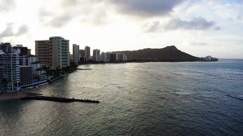 Aerial view of the Castle Waikiki Shore hotel with private dock lining Oahu