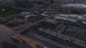 Aerial view of downtown St. Louis at sunset, featuring city buildings, Dome at America's Center, and the urban landscape transitioning from day to dusk - Powered by Shutterstock - Get 15% off with code: PIKWIZARD15
