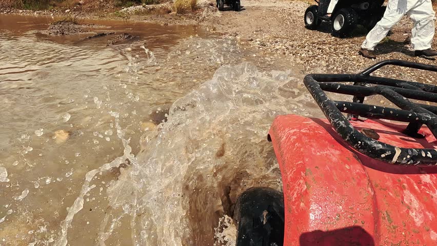 Safari Ride With ATV Quad Bikes Through the Kemer, Turkey. Adventures of Off-road on ATV. Mountains, Rocks and River Road Quad Cycle Travel. Excursion With People POV 4K Slow Motion Video.