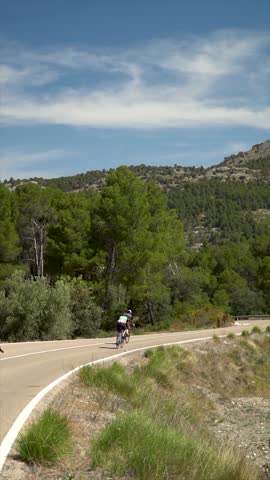 Slow motion, group of cyclists on a lonely road
