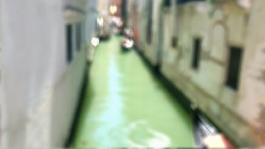 Blurred romantic background of a Gondola on a summer day in a canal in the city of Venice. Italy.