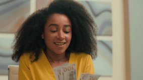 Happy joyful African American business woman rich successful businesswoman entrepreneur counting money dollars cash financial wage credit smiling female girl bank worker count finance salary in office - Powered by Shutterstock - Get 15% off with code: PIKWIZARD15