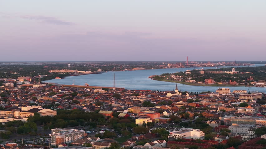 Aerial view of new orleans and Mississippi River at sunset, showcasing the city