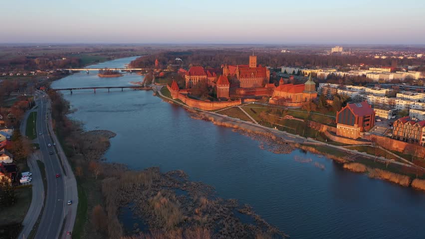 Malbork castle over the Nogat river at sunset, Poland