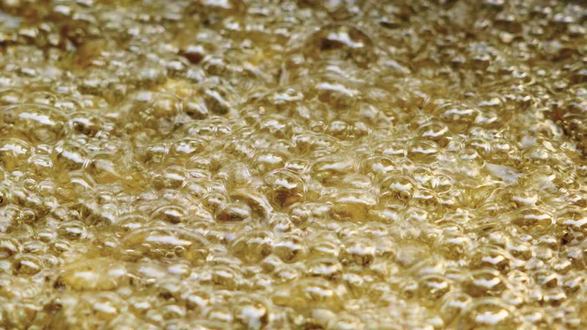 closeup of hot bubbling boiling oil background.