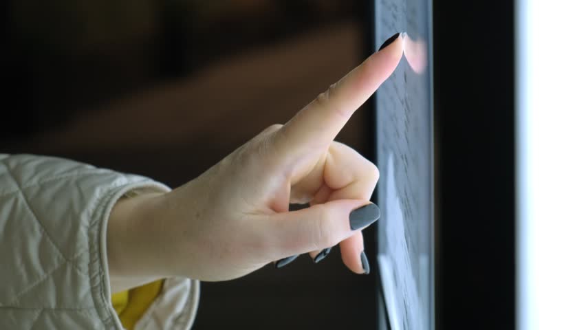Person touching illuminated touchscreen display with finger at night, showcasing technology interaction. - Powered by Shutterstock - Get 15% off with code: PIKWIZARD15