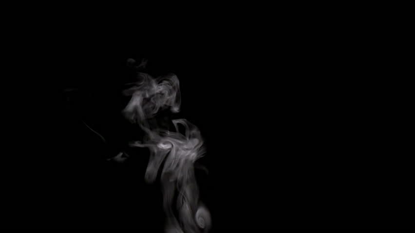 Steam Rises From the Cup. White smoke on black background. Slow Motion