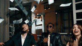 A group of young people in stylish suits throw dollar bills up. Lottery and casino concept. Friends throw money up. 4k - Powered by Shutterstock - Get 15% off with code: PIKWIZARD15