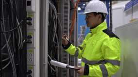 Electrical engineer inspects high-voltage electrical cabinet,Technician maintains the factory's electricity meter. - Powered by Shutterstock - Get 15% off with code: PIKWIZARD15