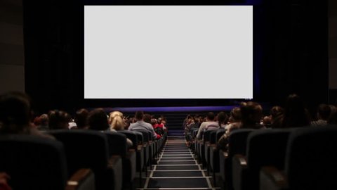 Viewers in the cinema house. Blank Screen.  