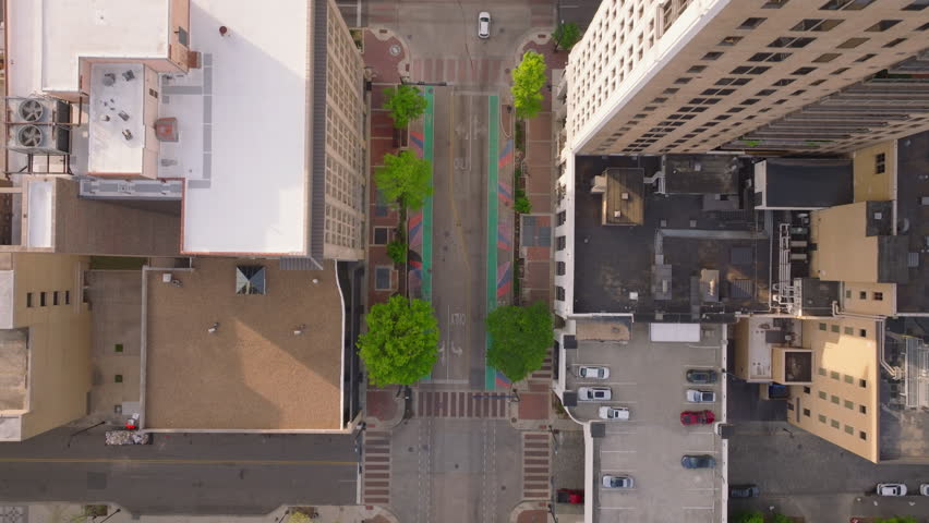 Aerial view of Birmingham, Alabama, USA, capturing its bustling streets, tall buildings rooftops with air conditioning systems from above