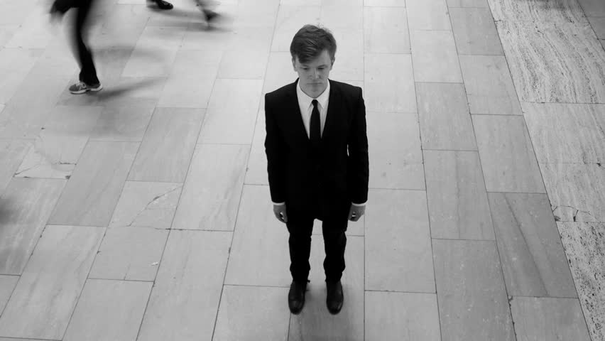  Black and White of Man Stands against the Backdrop of Crowd Time Lapse Movement