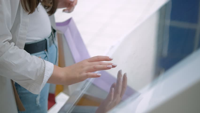 A closeup shot displays a person using a touchscreen, highlighting contemporary tech and user engagement - Powered by Shutterstock - Get 15% off with code: PIKWIZARD15