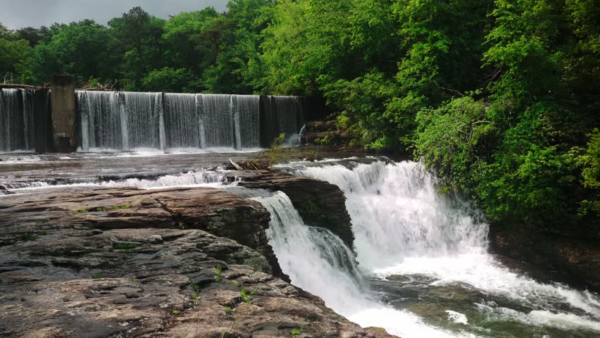 Explore the captivating beauty of DeSoto Falls, an enchanting natural wonder nestled amidst the lush forests of Lookout Mountain in Alabama. This high-definition video captures the mesmerizing cascade