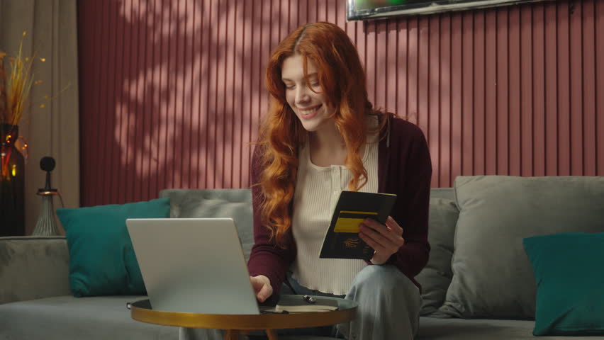 Caucasian woman client customer buyer hold credit card pay online web bank using laptop at home happy girl female satisfied payment transaction send money credit for mortgage business order shopping