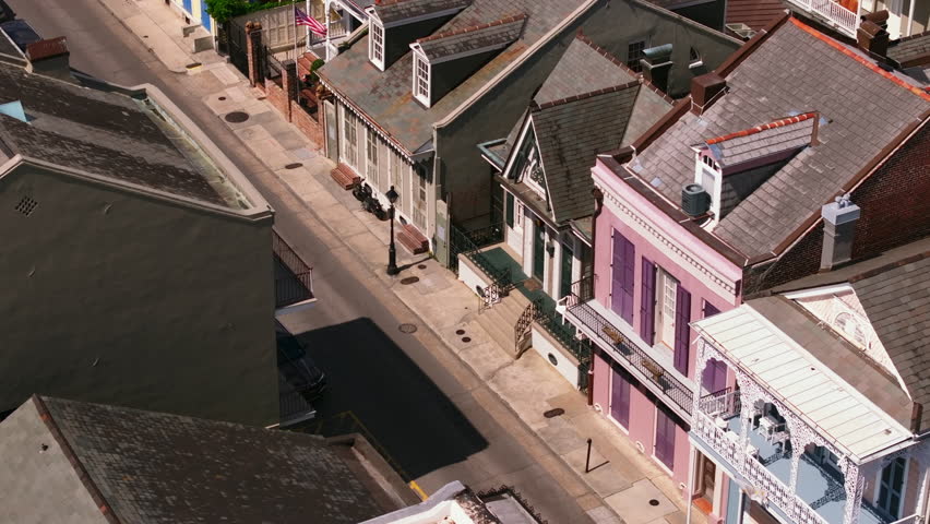 A secondary street of French Quarter, showcasing historic architecture of New Orleans with colorful homes and quiet streets in this captivating aerial view